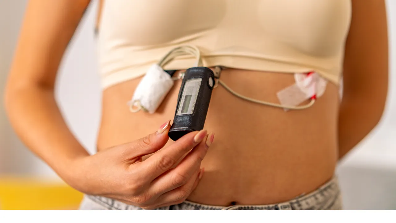 A small portable ECG recorder clipped to a patient's waistband